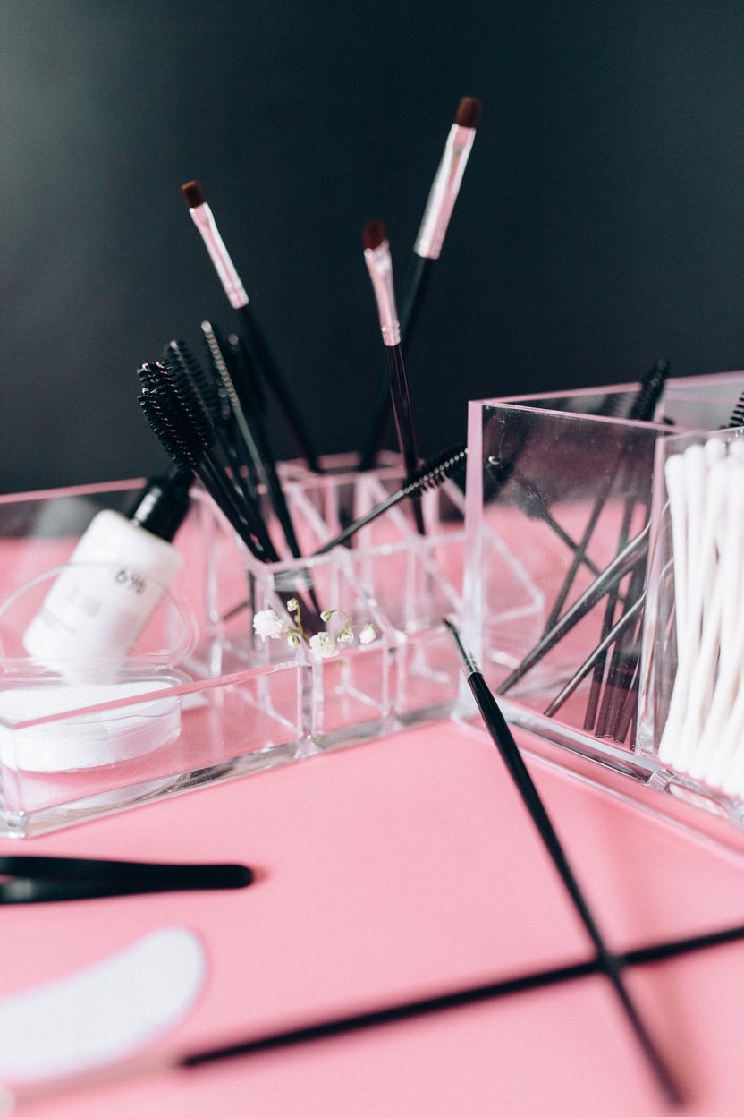 Close-up Photo of Make-up Brushes and Spoolie 